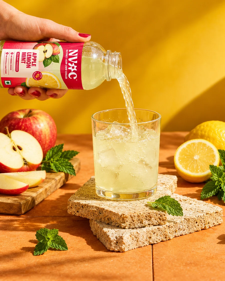 NVOC Apple Lemon Mint poured into a glass with apple and mint